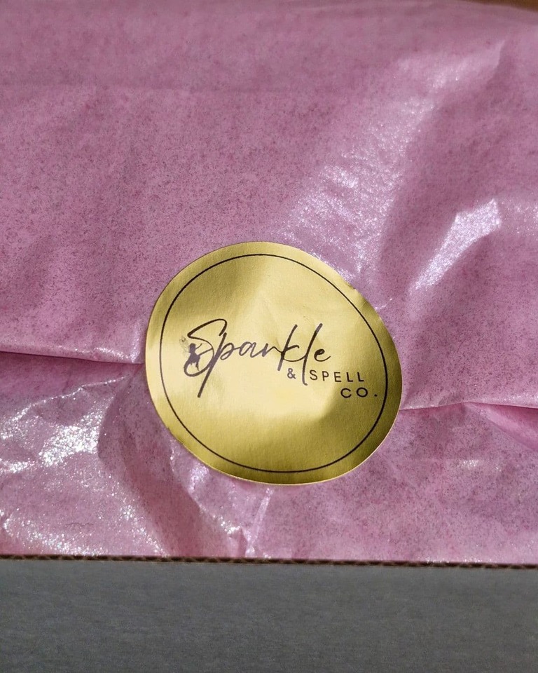Faerie Secrets Magic Potion Kit for Two – eco-friendly pink tissue wrapping sealed with Sparkle & Spell Co. gold logo sticker.