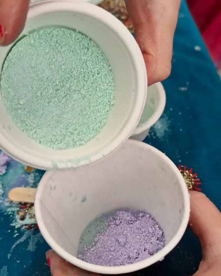Sea-green and lavender potion powders ready to mix from the Secrets of the Sea Magic Potion Kit by Sparkle & Spell Co., made with safe, food-grade ingredients.
