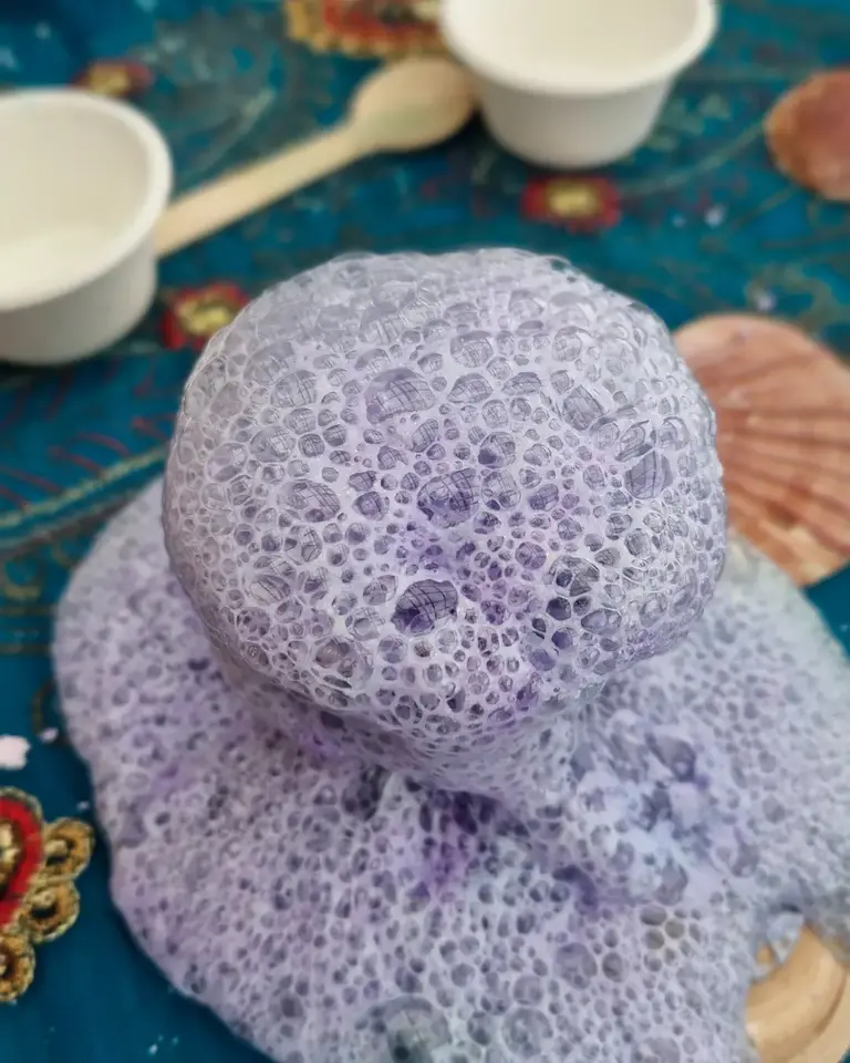 Magical lavender potion bubbling and foaming from the Secrets of the Sea Magic Potion Kit — eco-friendly sensory play for kids by Sparkle & Spell Co.