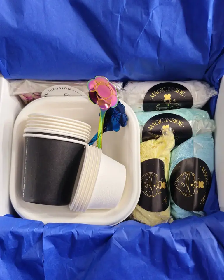 Inside the Sorcerer’s Spellbook Magic Potion Kit for Two — includes bowls, cups, floral infusion, potions, and magical spoons in eco-friendly packaging.